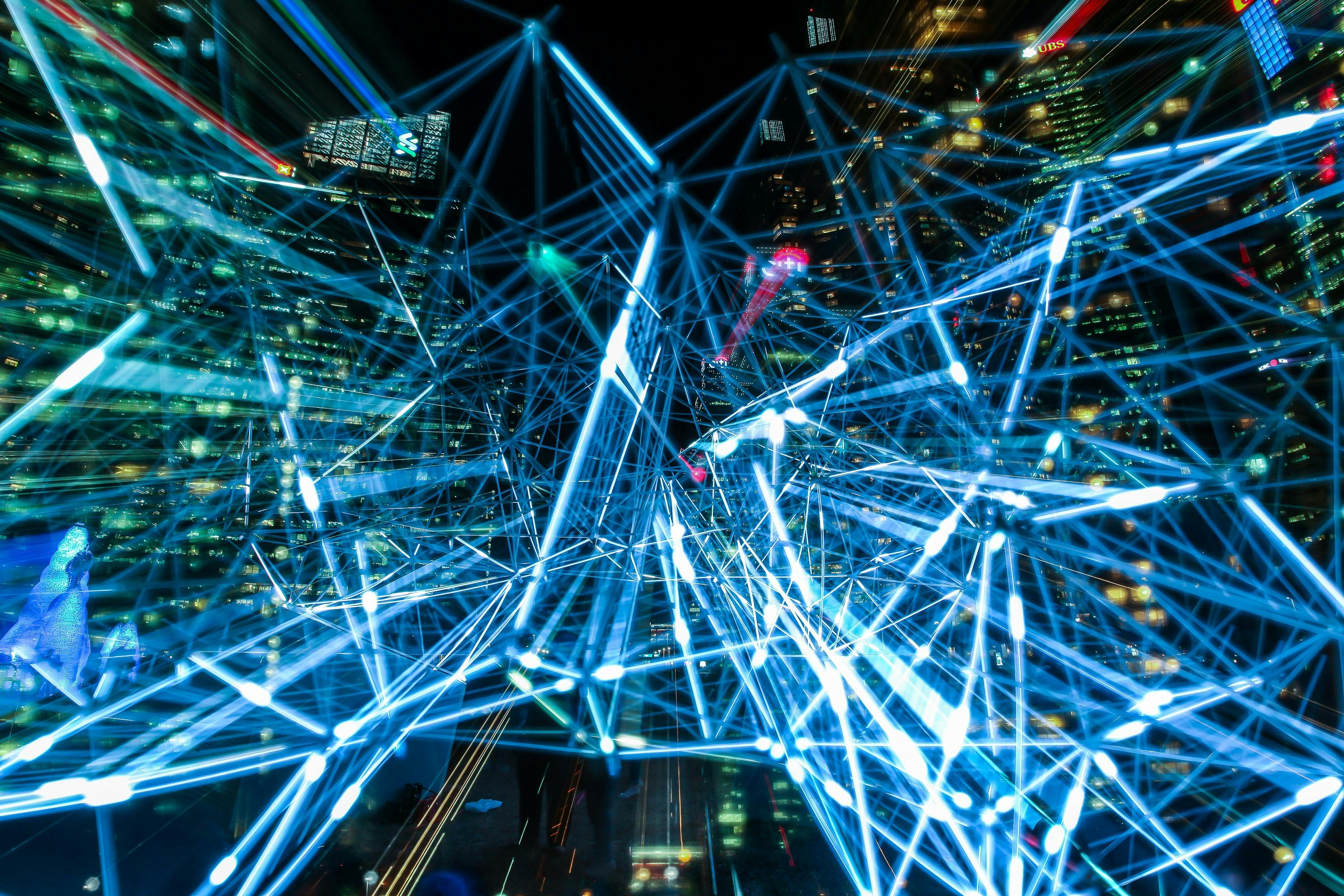 Buildings at night with streaking lights in foreground